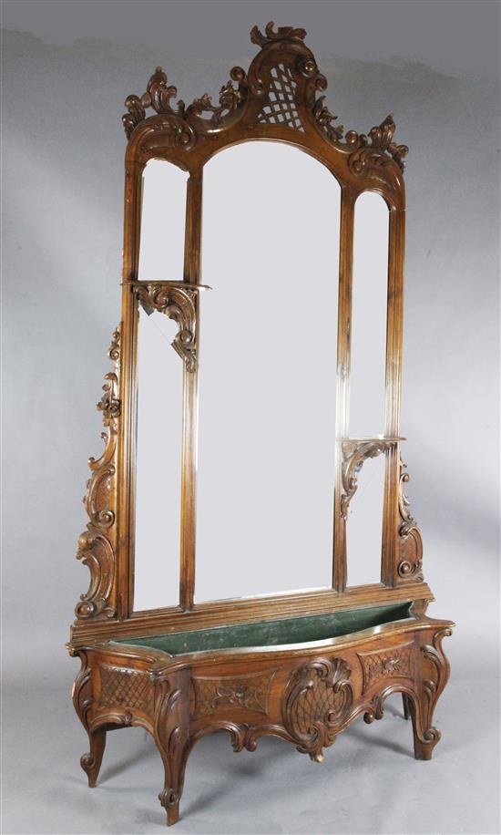 An early 20th century French carved walnut hall mirror, W.5ft H.8ft 10in.